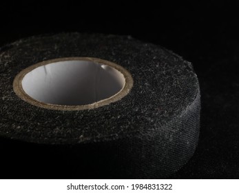 A Closeup Shot Of A Duck Tape Roll On A Black Background