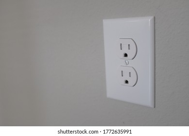 A Closeup Shot Of An Electric Plug -- Side View On The Wall