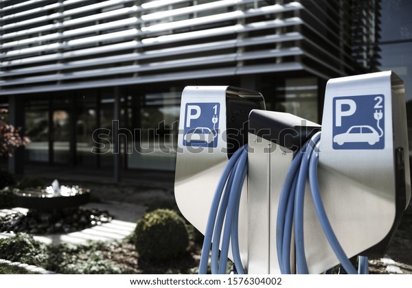 A closeup shot of an electrical car plug-in
symbol with a blurred
background