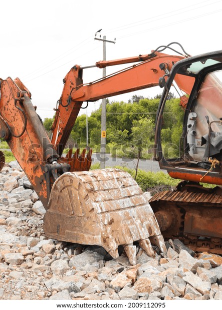 A closeup shot of an excavator machine in a\
construction site