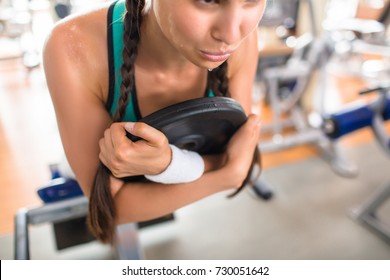 Close-up Shot Of Exhausted Sporty Woman Dripping With Sweat Having Intensive Workout At Modern Gym, She Building Leg Muscles With Machine