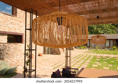 A Closeup Shot Of A Fancy Lamp In An Outdoors Restaurant