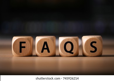 Close-up Shot of FAQS wooden blocks.