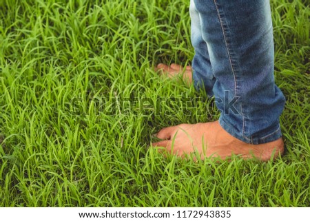 Closeup shot of the feet in the grass