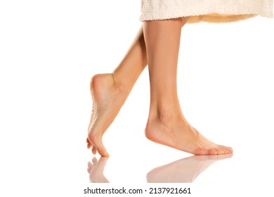 Closeup Shot Of Female Bare Feet, Isolated On White Background