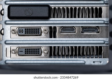 A closeup shot of firewire and small inputs on a digital computer workstation