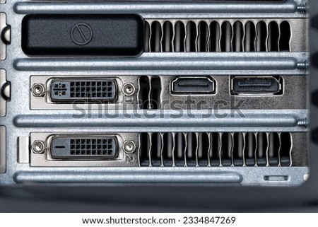A closeup shot of firewire and small inputs on a digital computer workstation