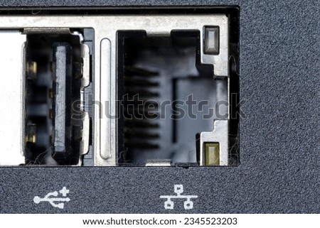A closeup shot of firewire and small inputs on a digital computer workstation
