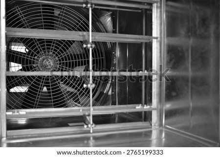 Close-up shot of flaps of fire, volume damper and ventilation fan.