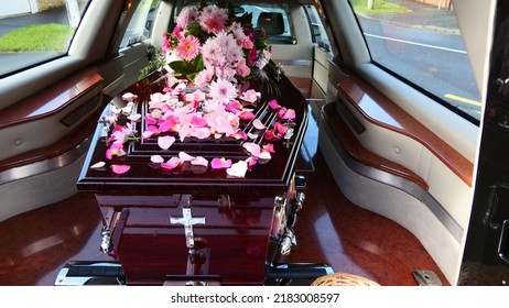 closeup shot of a funeral casket or coffin in a hearse or chapel or burial at cemetery
 - Shutterstock ID 2183008597