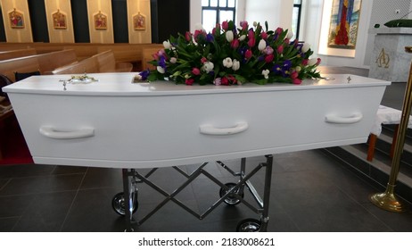 closeup shot of a funeral casket or coffin in a hearse or chapel or burial at cemetery
 - Shutterstock ID 2183008621