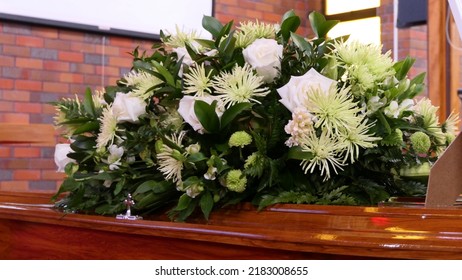 closeup shot of a funeral casket or coffin in a hearse or chapel or burial at cemetery
 - Shutterstock ID 2183008655