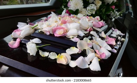 closeup shot of a funeral casket or coffin in a hearse or chapel or burial at cemetery
 - Shutterstock ID 2183008665