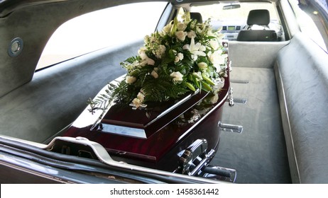 Closeup Shot Of A Funeral Casket In A Hearse Or Chapel Or Burial At Cemetery
