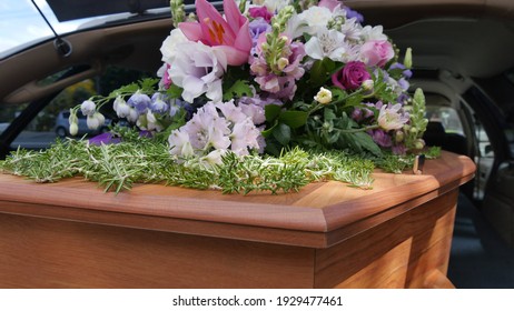 closeup shot of a funeral casket in a hearse or chapel or burial at cemetery
 - Shutterstock ID 1929477461