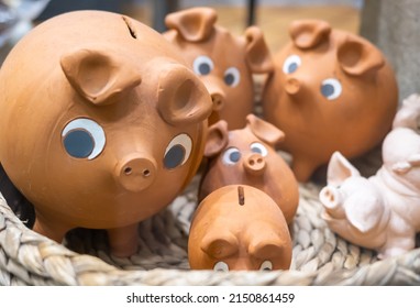 A closeup shot of Funny clay piggy banks to save money