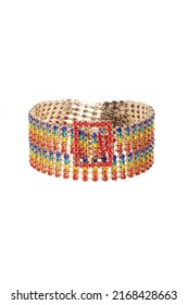 Close-up shot of a gold buckle bracelet with multicolored rhinestones. The multicolored rhinestone bracelet is isolated on a white background. Front view.