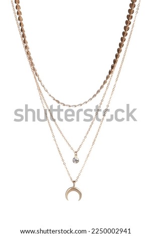 Close-up shot of a gold necklace with star pendants. Set of three different chains. One necklace with a crescent moon pendant. The necklace is isolated on a white background. Front view.