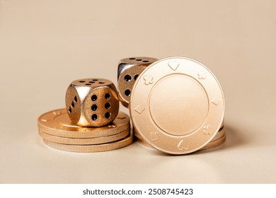 Close-up shot of golden casino dice and poker chips on a beige background. The image is perfect for concepts of gambling, luck, and fortune. - Powered by Shutterstock