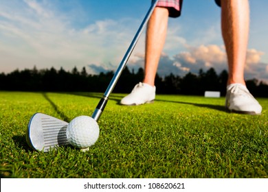 Closeup Shot Of Golf Ball With Golf Club Right Before Tee Off