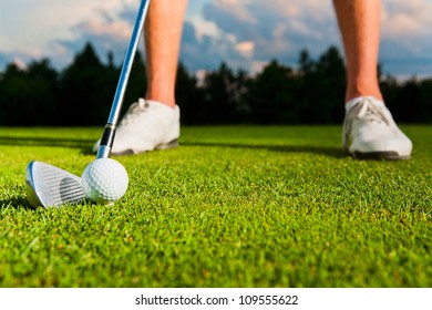 Closeup Shot Of Golf Ball With Golf Club Right Before Tee Off