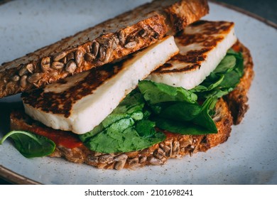 A Closeup Shot Of A Gourmet Fried Tofu Sandwich