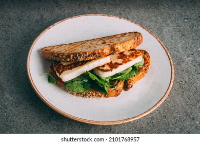 A Closeup Shot Of A Gourmet Fried Tofu Sandwich C