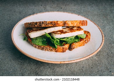 A Closeup Shot Of A Gourmet Tofu Sandwich On A Plate