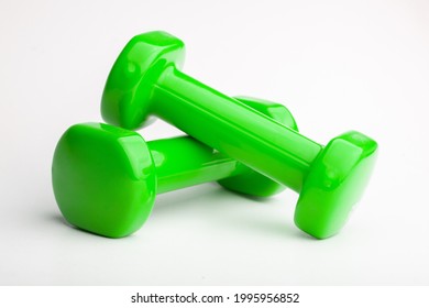 A Closeup Shot Of Green Dumbells Isoalted On A White Backgound