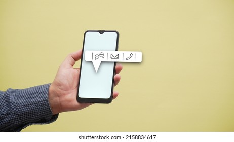 A Closeup Shot Of A Hand Carrying A Mobile Phone With The Logo Of The Notification Bar Included A Phone And Messages Sign
