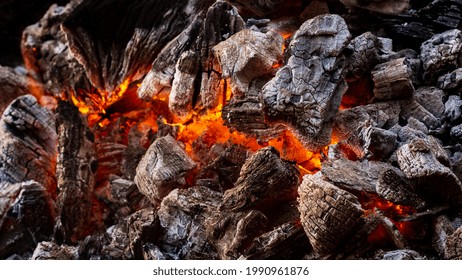 A Closeup Shot Of Hot Burning Charcoal Slowly Turning Into Ashes