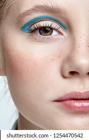 Closeup Shot Of  Human Female Face. Girl With Perfect Skin And Blue Smoky Eyes Eye Shadows. Woman With Vogue Face Beauty Makeup. 