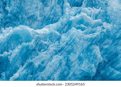 A closeup shot of the ice texture of a blue glacial wall in Inside Passage, Alaska - Powered by Shutterstock