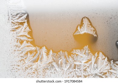 A Closeup Shot Of Icy Floral Patterns On The Glassy Surface