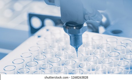 Close-up Shot of the Industrial Manufacturing Medical Test Tubes, Process of Sterilising and Filling Items. Sterile High Precision Factory Machinery Producing Items for Medical Use. Abstract Concept.