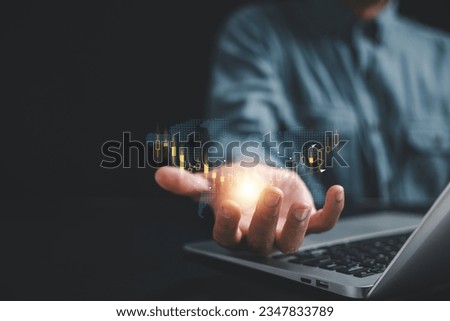 Close-up shot, Investor or trader man demonstrates a hologram of a stock growing chart on his palm. Stock market data analysis, trading strategies, and business growth concepts. Seize the opportunity.