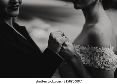 A Closeup Shot Of A Lesbian Couple Getting Married And Holding Hands