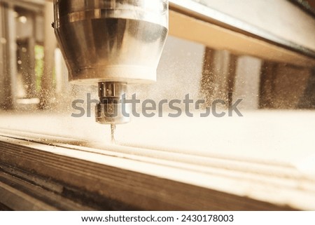 Close-up shot of machine with numerical control cuts wood. Cnc tool.