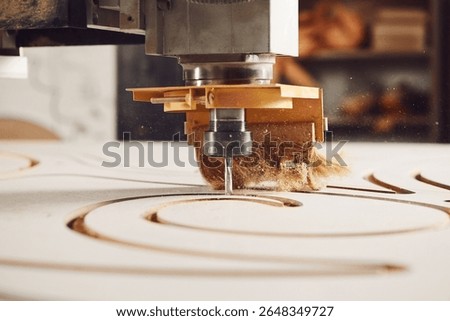Close-up shot of machine with numerical control cuts wood. Cnc tool.