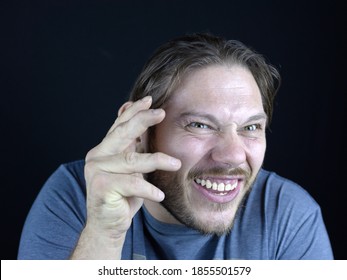 A Close-up Shot Of A Male Making A Goofy Face