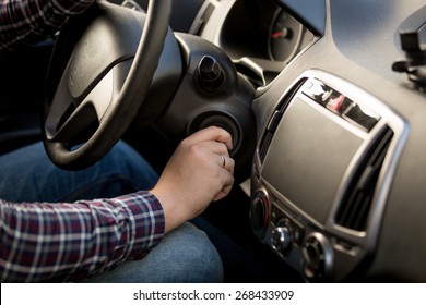 Closeup Shot Of Man Inserting Key In Car Ignition Lock