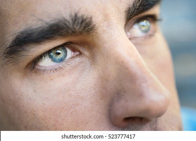 Close-up shot of man's eye. Man with blue eyes. - Powered by Shutterstock