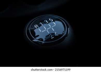 A closeup shot of the manual gear shifter isolated on  dark background