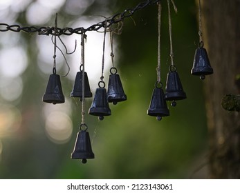 A Closeup Shot Of Many Metal Hanging Bells