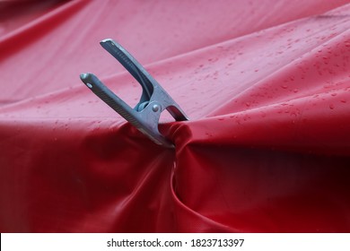 A Closeup Shot Of A Metal Clip On A Canvas Tarp