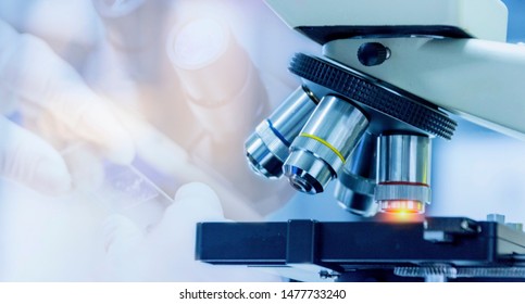  Close-up shot of microscope equipment with metal lens at microbiologal laboratory - Shutterstock ID 1477733240