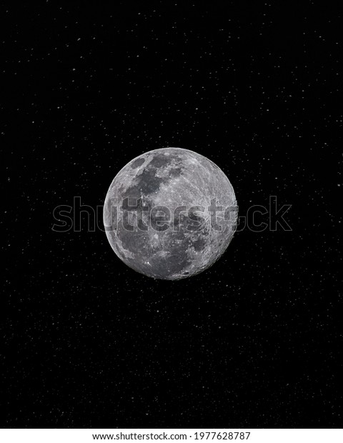 A close-up shot\
of Moon in the starry sky