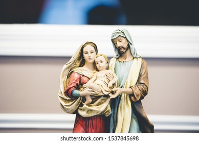 A closeup shot of the mother Mary figurine with a blurred background