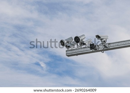 A close-up shot of multiple high-tech cameras and flash units mounted on a boom, used for traffic enforcement, flex flashes (for speed) and focus flashes (for phone use) in the Netherlands.