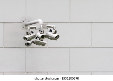 Close-up Shot Of Multiple Security Cameras Attached To A Wall In Singapore